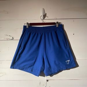 Blue Gymshark shorts, size medium.